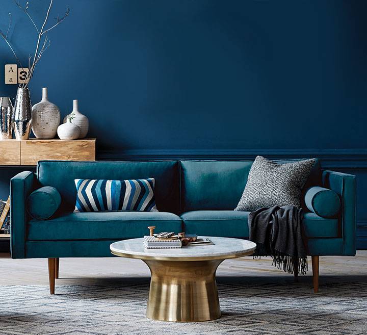 This marble-topped pedestal coffee table with an antique brass base from Vancouver’s West Elm is elegant and sculptural but still substantial enough to put your feet up on. (westelm.com, $699)