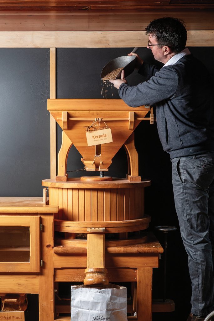 Man sifting grain Man sifting grain