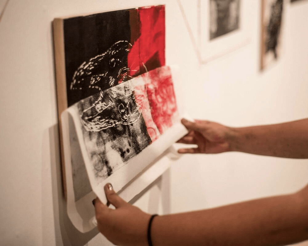 2015 Indigenous Youth Artists Program participant working with Peter Morin’s exhibition, Tahltan Song Cycle.