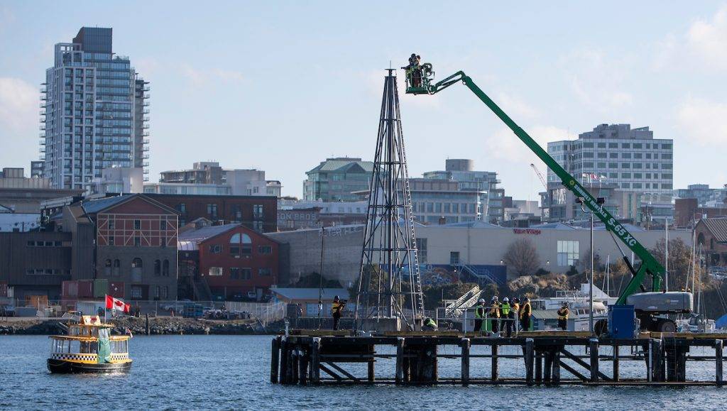 A construction crew prepares the holiday lights tour that will illuminate Victoria's harbour this Christmas season. Photo: Kevin Light.