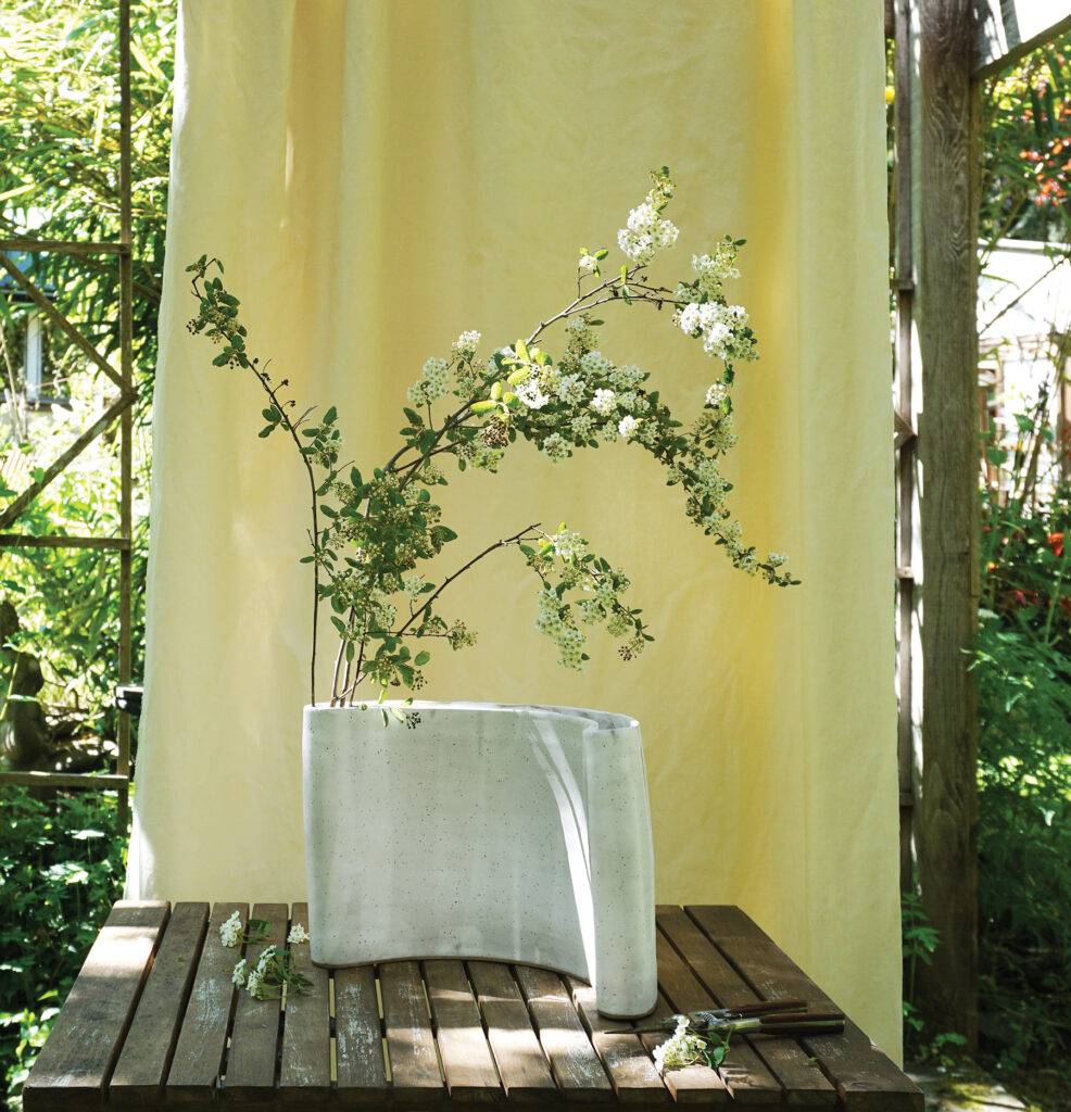Display sprays of spring blossoms in a sculptural vase that is also a piece of art. (YAM Magazine Home Issue Mar/Apr 2023)