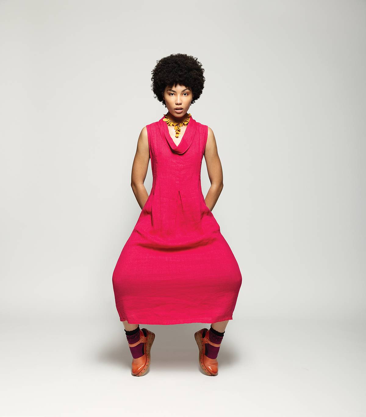 Hot pink dress by Linen Luv and Sienna necklace in yellow, both available at Butik Naturals. Patched two-tone socks by B.ella, available at De Mode En Vogue. Bianca sandals by A.S. 98, available at Waterlily Shoes.
