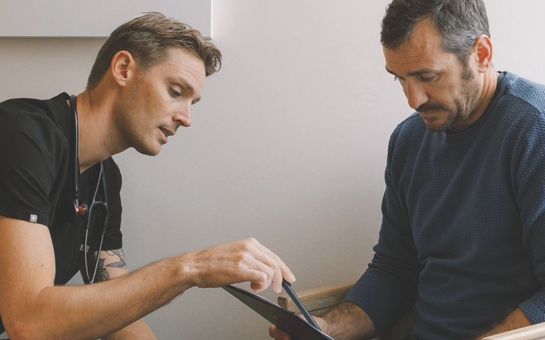 Dr. Matt Carere consults with a patient