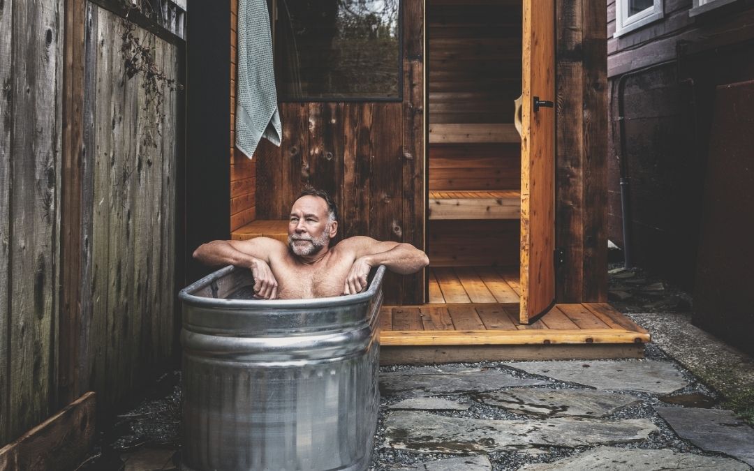 David Lennam experiences the cold plunge outside his custom backyard sauna